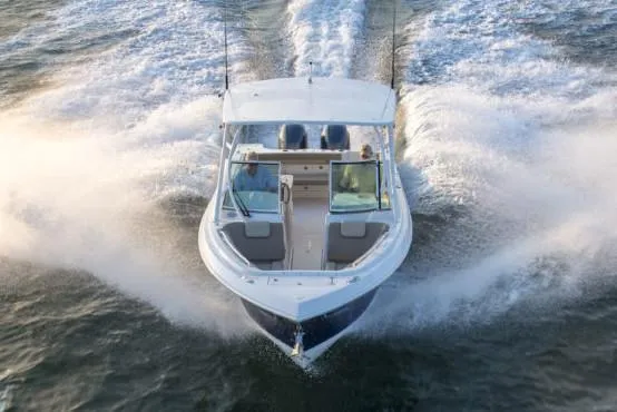 Slide: The Image of Manufacturer Provided Image: 2019 Sailfish 275 DC boat cruising on water, aerial view. - 2