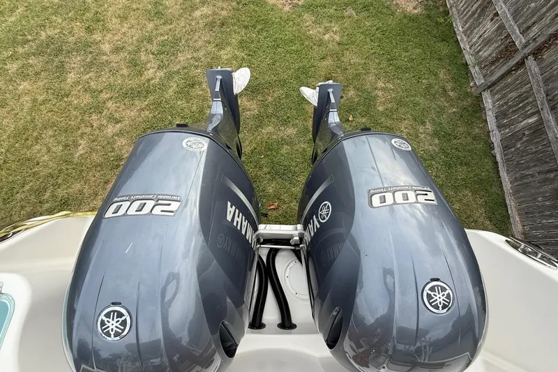 Slide: The Image of Twin Yamaha 200 engines on a 2019 Sailfish 275 DC boat, viewed from above. - 8