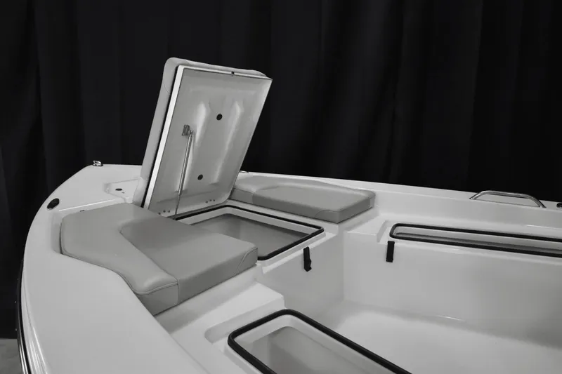 Slide: The Image of 2024 KenCraft 219 Bay Rider Bay boat interior with open storage compartments. - 10