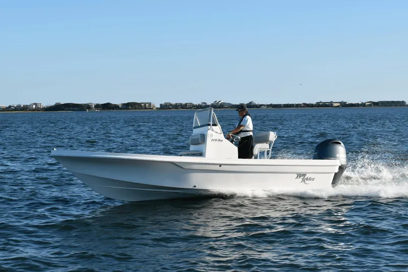 Slide: The Image of 2024 KenCraft 219 Bay Rider Bay boat cruising on open water. - 14
