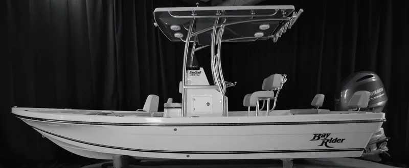 Slide: The Image of 2024 KenCraft 219 Bay Rider Bay boat with T-top and outboard motor. - 7