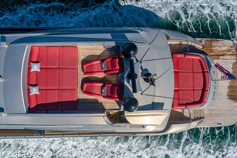 Slide: The Image of Aerial view of 2008 Pershing 90 yacht with red seating and ocean waves. - 12