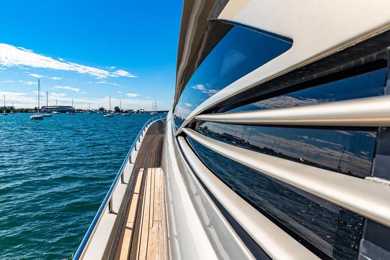Slide: The Image of Side view of a 2008 Pershing 90 yacht cruising on a sunny day. - 20