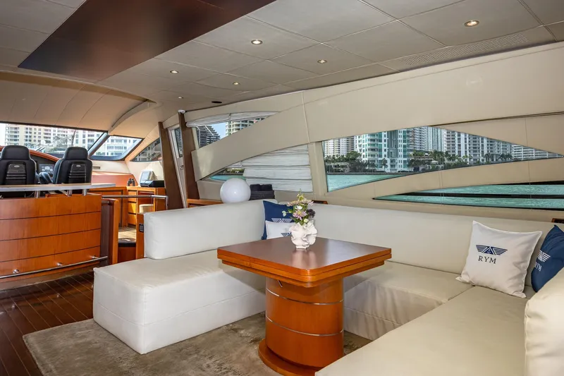 Slide: The Image of Luxurious interior of 2008 Pershing 90 yacht with elegant seating and cityscape view. - 28