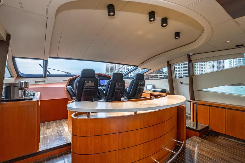 Slide: The Image of Luxurious interior of 2008 Pershing 90 yacht with modern helm and seating area. - 30