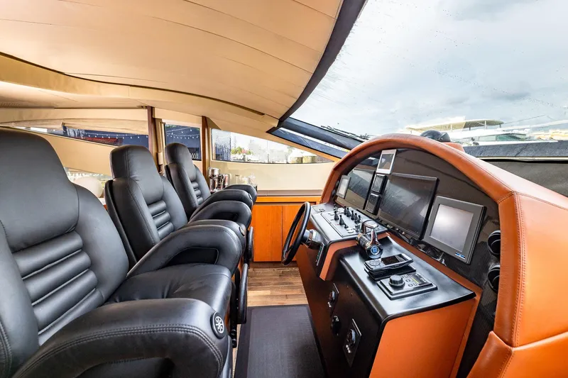 Slide: The Image of Luxurious 2008 Pershing 90 yacht cockpit with leather seats and advanced navigation controls. - 31