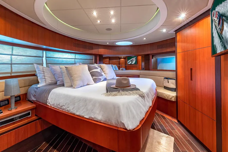 Slide: The Image of Luxurious 2008 Pershing 90 yacht bedroom with elegant wood finishes and modern decor. - 36