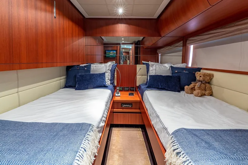Slide: The Image of Luxurious 2008 Pershing 90 yacht cabin with twin beds and plush decor. - 38