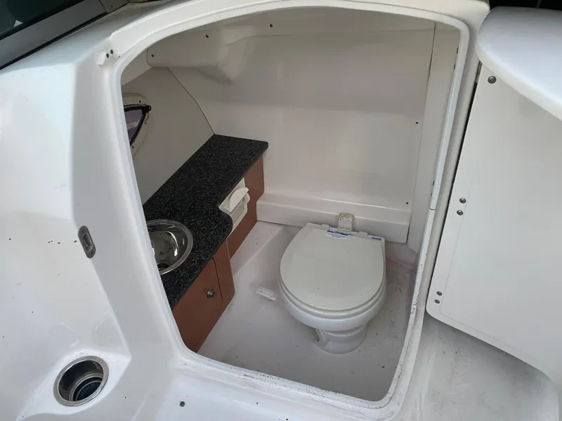 Slide: The Image of 2008 Chaparral Sunesta 244 boat interior with toilet and sink. - 10