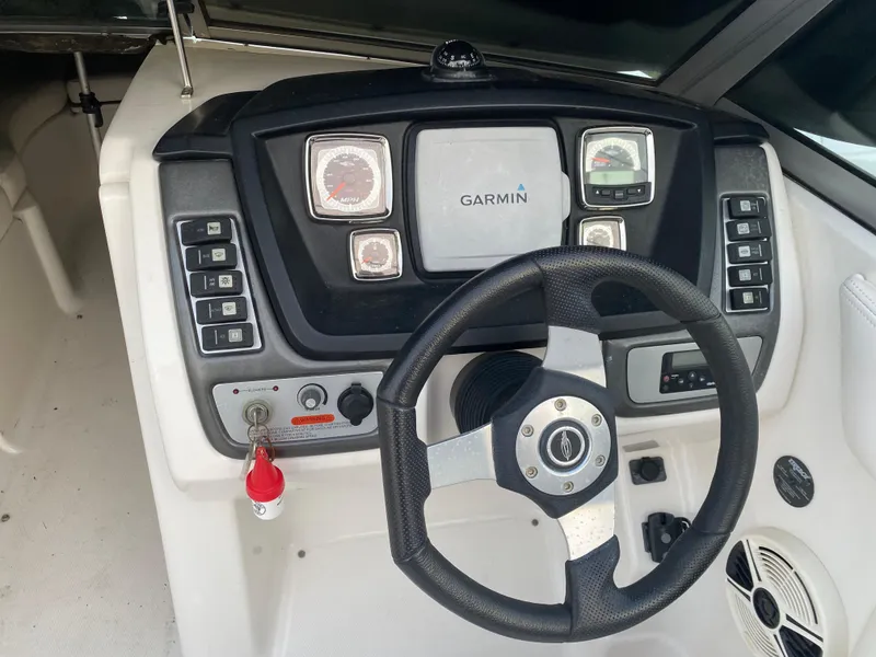 Slide: The Image of 2008 Chaparral Sunesta 244 dashboard with Garmin navigation and steering wheel. - 6
