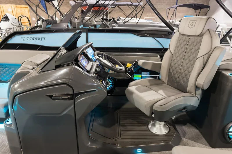 Slide: The Image of Luxurious 2026 Godfrey Sanpan 23' Split Bench boat interior with modern helm and seating. - 14