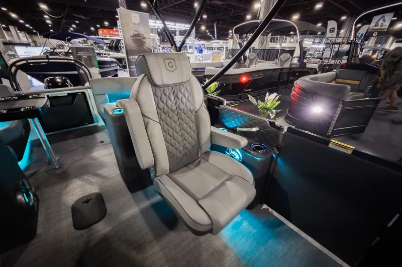 Slide: The Image of 2026 Godfrey Sanpan 23' Split Bench boat interior with luxurious seating and ambient lighting. - 22