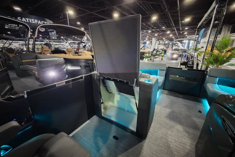 Slide: The Image of 2026 Godfrey Sanpan 23' Split Bench 2300 SBC interior with modern seating and ambient lighting. - 24