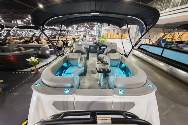 Slide: The Image of 2026 Godfrey Sanpan 23' Split Bench pontoon boat with illuminated seating and canopy. - 29