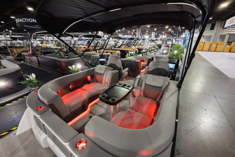 Slide: The Image of 2026 Godfrey Sanpan 23' Split Bench pontoon boat with luxurious seating and ambient lighting. - 30