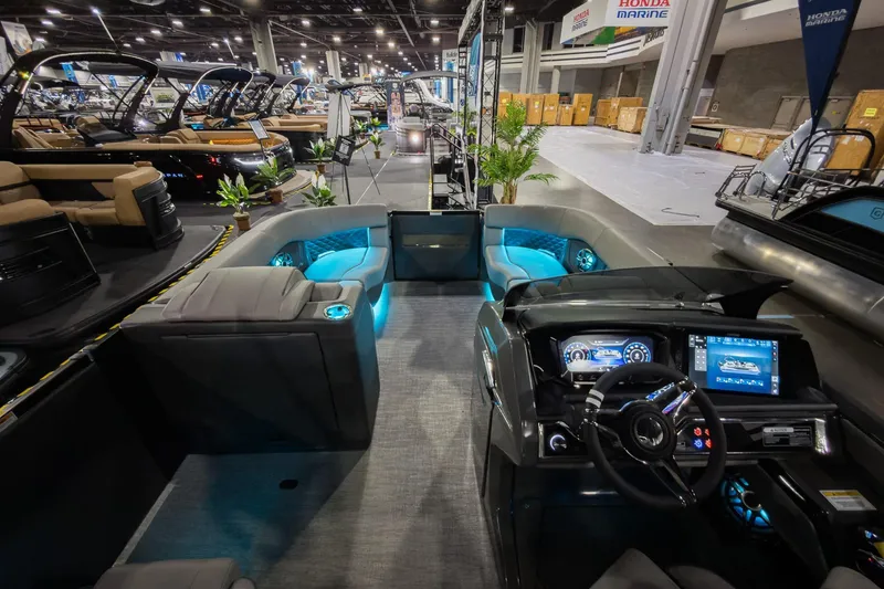 Slide: The Image of Luxurious 2026 Godfrey Sanpan 23' Split Bench pontoon boat interior at a boat show. - 32