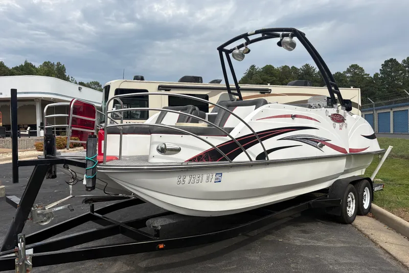 Slide: The Image of 2017 Razor 238 PF XL boat on trailer, parked outdoors with overcast sky. - 13