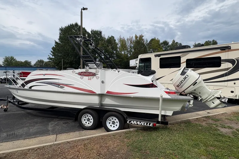 Slide: The Image of 2017 Razor 238 PF XL boat on trailer with Suzuki outboard motor. - 14