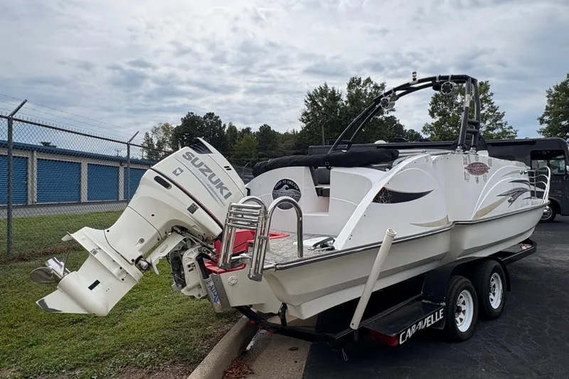 Slide: The Image of 2017 Razor 238 PF XL boat with Suzuki outboard motor on trailer. - 4