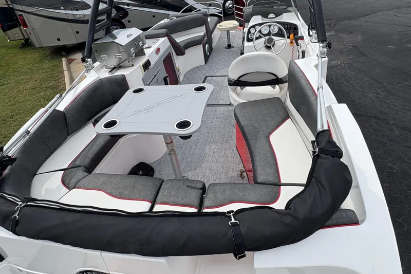 Slide: The Image of Interior of a 2017 Razor 238 PF XL boat with seating and steering wheel. - 7