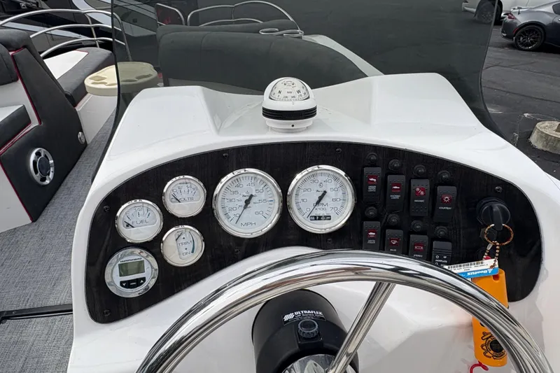 Slide: The Image of Control panel of a 2017 Razor 238 PF XL boat with gauges and switches. - 9