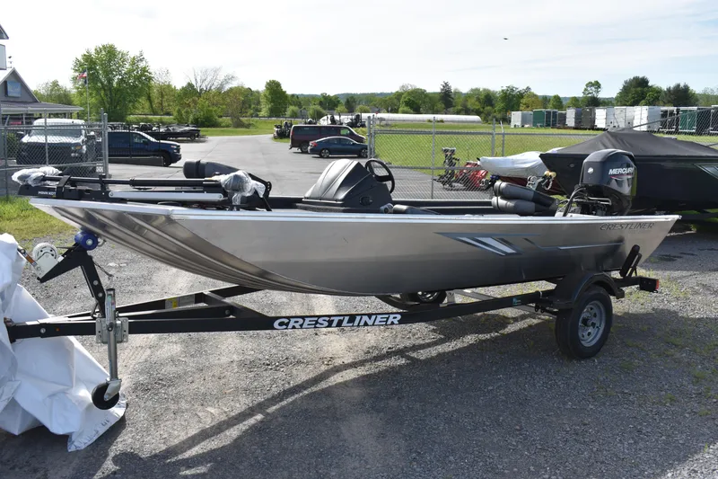 The Image of 2025 Crestliner 1700 Storm boat on trailer in outdoor setting. - 0