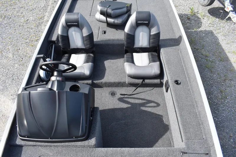 Slide: The Image of 2025 Crestliner 1700 Storm boat interior with dual seats and steering console. - 5