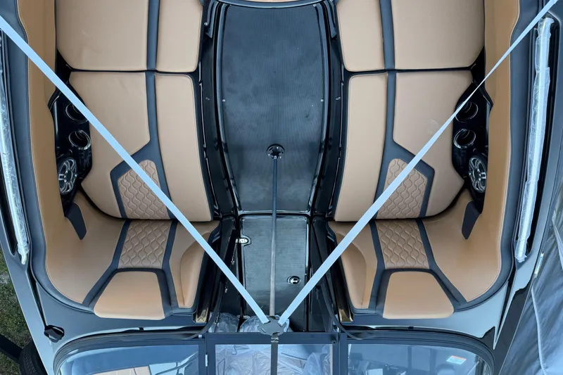 Slide: The Image of 2026 Yamaha Boats 255XD interior with tan and black seating, overhead view. - 10