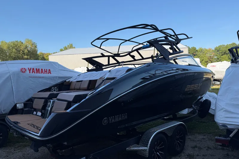 Slide: The Image of 2026 Yamaha Boats 255XD, sleek design, parked outdoors on a trailer. - 4