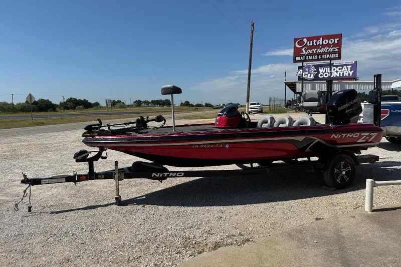 Slide: The Image of 2013 Nitro Z7 SC boat on trailer at outdoor dealership. - 4