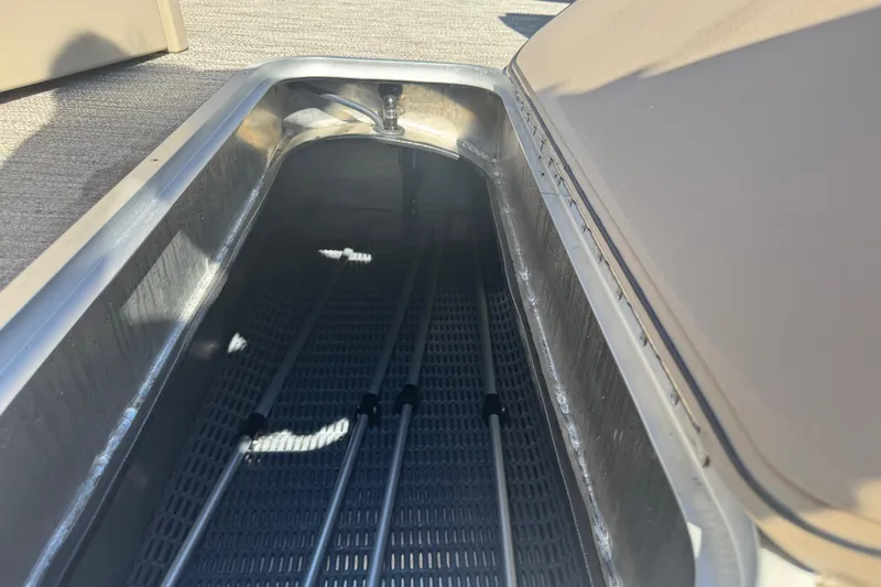 Slide: The Image of Open storage compartment in 2026 Godfrey Xperience 2286 SBX boat, showing interior details. - 19