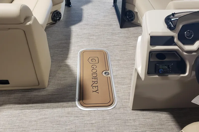 Slide: The Image of Interior of 2026 Sweetwater EX2286SBX boat with Godfrey-branded flooring and beige seating. - 4