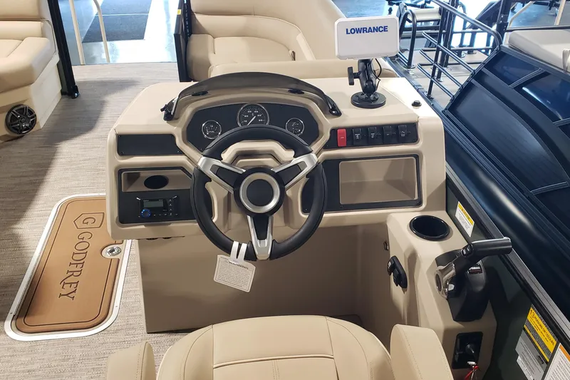 Slide: The Image of 2026 Sweetwater EX2286SBX boat dashboard with steering wheel, Lowrance display, and control panel. - 5