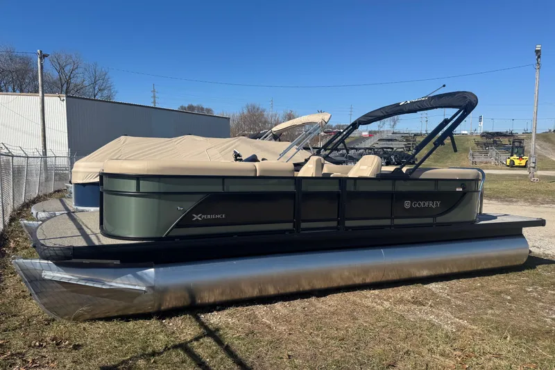 The Image of 2026 Godfrey Xperience 2286 SBX pontoon boat with cover, parked outdoors. - 9