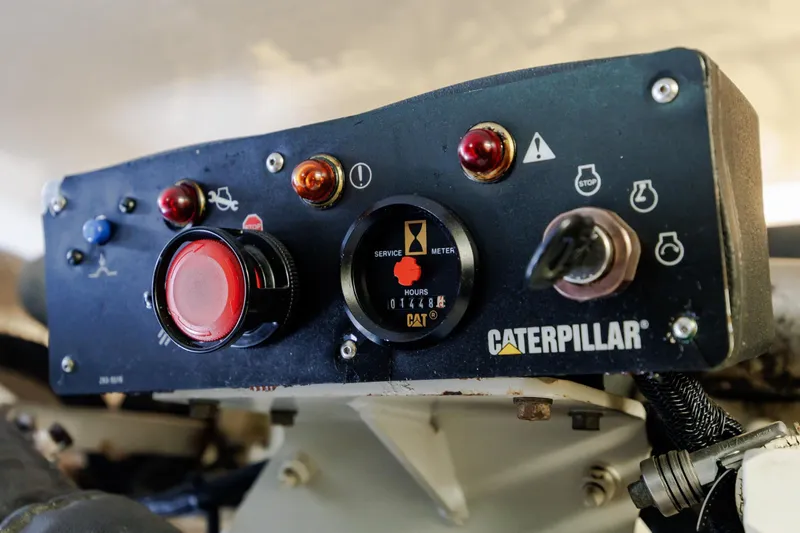 Slide: The Image of Control panel of a 2005 Hatteras 50 Convertible with Caterpillar engine. - 102