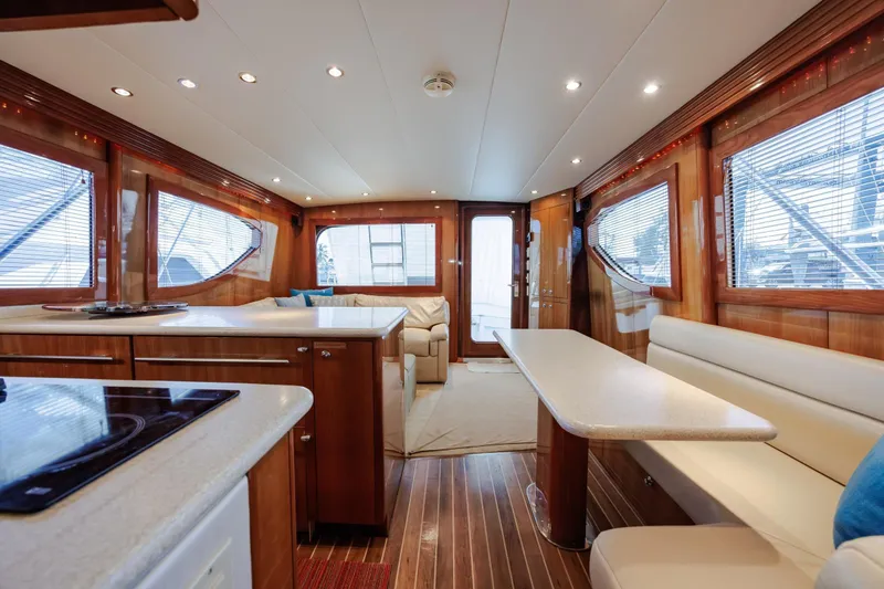 Slide: The Image of Luxurious interior of 2005 Hatteras 50 Convertible yacht with elegant wood finishes. - 13