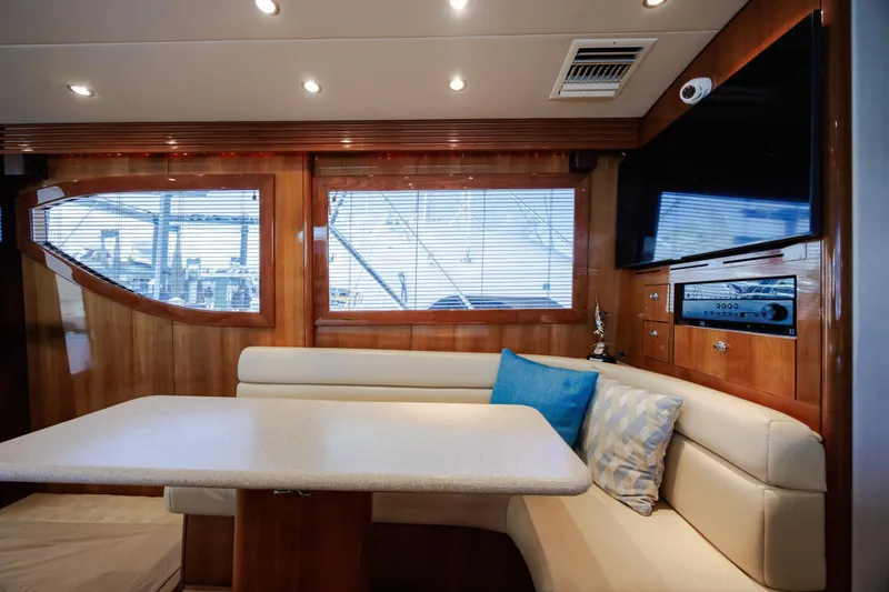Slide: The Image of Luxurious interior of 2005 Hatteras 50 Convertible yacht with plush seating and modern amenities. - 14