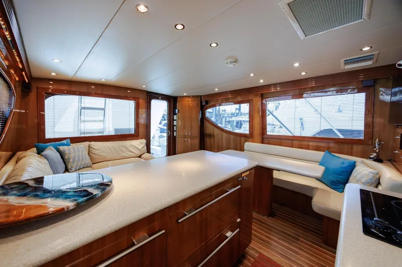 Slide: The Image of Luxurious interior of 2005 Hatteras 50 Convertible yacht with elegant seating and modern design. - 16