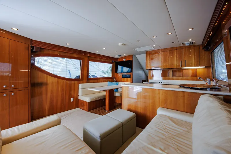 Slide: The Image of Luxurious interior of 2005 Hatteras 50 Convertible yacht with elegant wood finishes and modern amenities. - 17