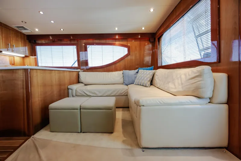 Slide: The Image of Luxurious interior of 2005 Hatteras 50 Convertible yacht with plush seating and elegant wood finishes. - 19
