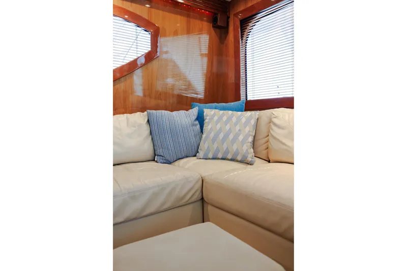 Slide: The Image of Luxurious interior of 2005 Hatteras 50 Convertible yacht with plush seating and decorative pillows. - 20