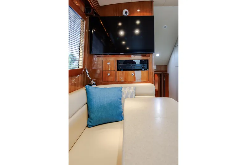 Slide: The Image of Luxurious interior of 2005 Hatteras 50 Convertible yacht with TV and seating area. - 21