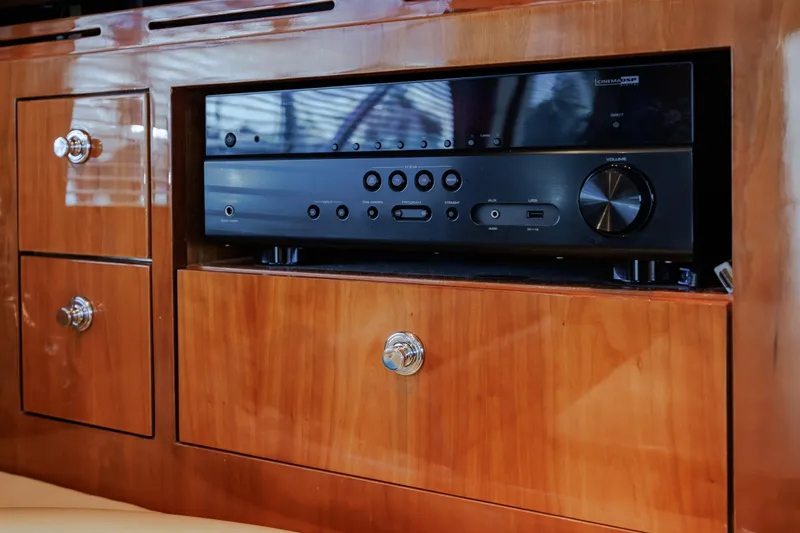 Slide: The Image of Audio system in 2005 Hatteras 50 Convertible yacht's wooden cabinet interior. - 25
