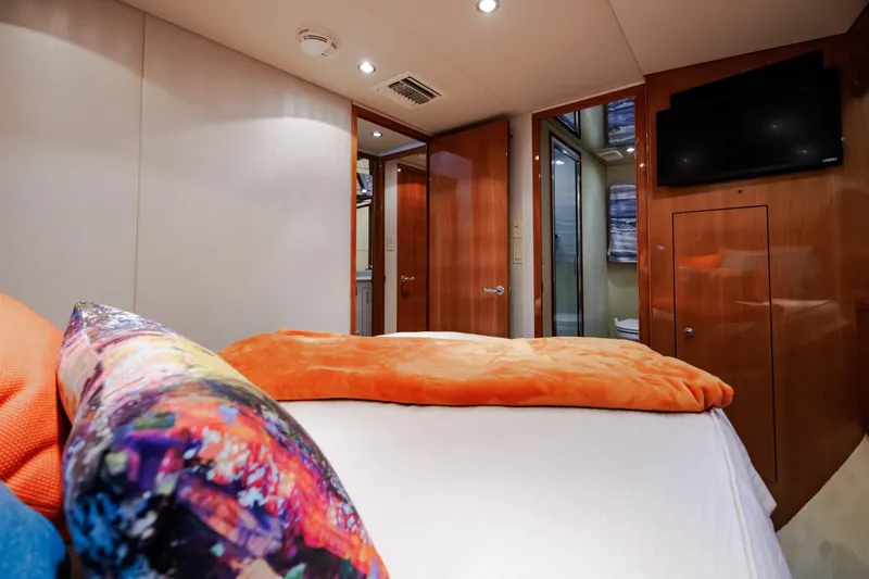 Slide: The Image of Luxurious cabin interior of 2005 Hatteras 50 Convertible yacht with vibrant bedding. - 31