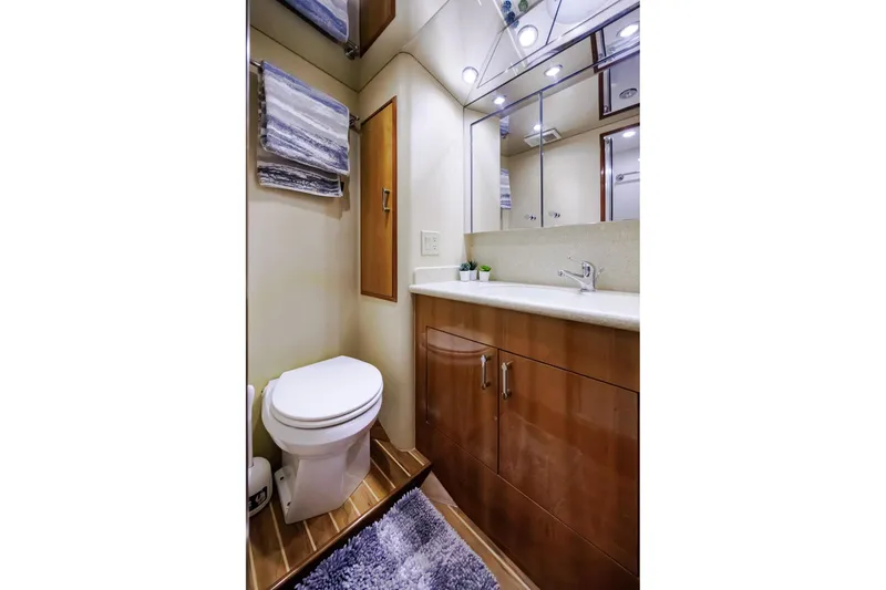 Slide: The Image of Luxurious bathroom in 2005 Hatteras 50 Convertible yacht with modern fixtures and elegant design. - 33