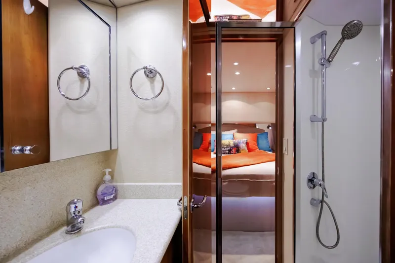 Slide: The Image of Luxurious bathroom and bedroom in 2005 Hatteras 50 Convertible yacht. - 34