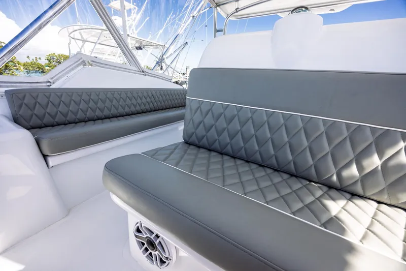 Slide: The Image of Luxurious seating on 2005 Hatteras 50 Convertible yacht with diamond-stitched upholstery. - 55