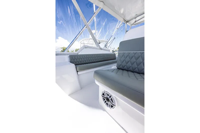 Slide: The Image of Luxurious seating on 2005 Hatteras 50 Convertible yacht with clear sky view. - 56