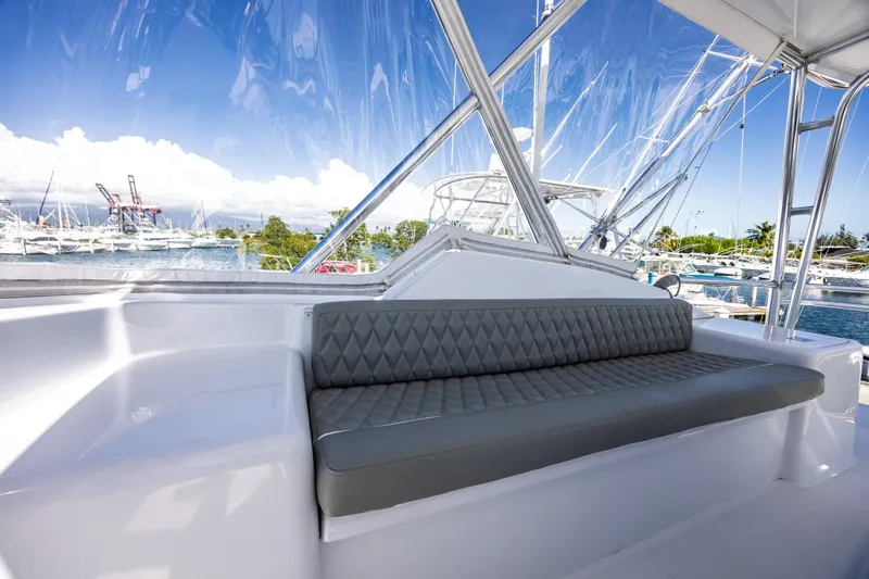 Slide: The Image of Luxurious seating on 2005 Hatteras 50 Convertible yacht with marina view. - 57
