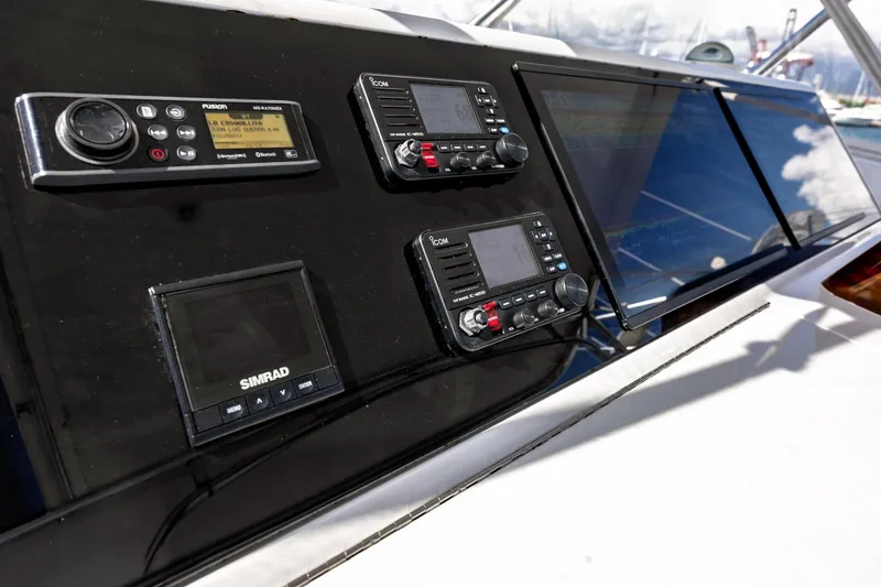 Slide: The Image of Control panel of 2005 Hatteras 50 Convertible yacht with navigation and communication equipment. - 63